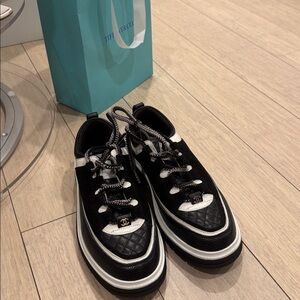 CHANEL women’s Black and White Sneakers